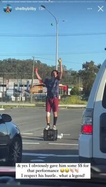 Man juggling and does backflip at Burleigh Heads intersection