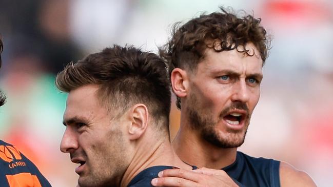 ADELAIDE, AUSTRALIA - APRIL 07: Stephen Coniglio of the Giants celebrates a goal with teammate Harry Perryman during the 2024 AFL Round 04 match between the Gold Coast SUNS and GWS GIANTS at Adelaide Hills - Mt Barker on April 07, 2024 in Adelaide, Australia. (Photo by Dylan Burns/AFL Photos via Getty Images)