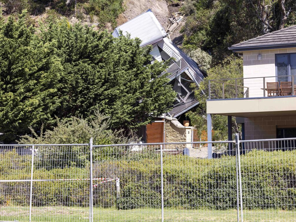 A council worker had to jump from the home as it fell. Picture: Wayne Taylor