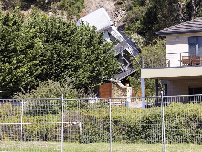 A council worker had to jump from the home as it fell. Picture: Wayne Taylor
