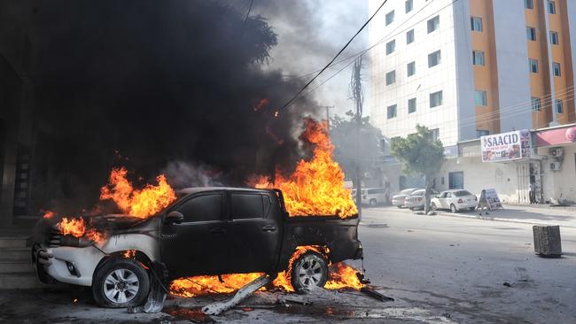 A vehicle burns after an explosion in front of Premier Bank in Mogadishu. Somalia is considered the most corrupt country in the world. Picture: AFP 