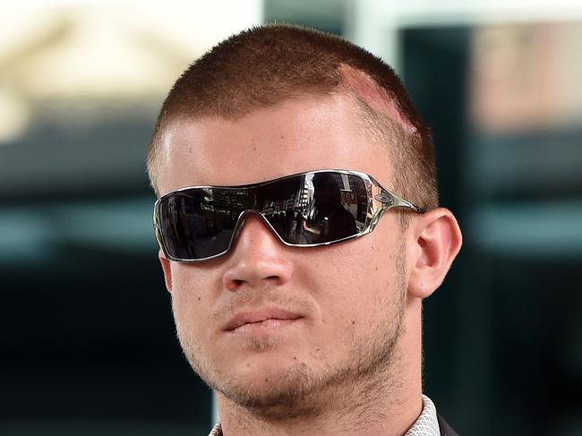 Matt Maloney, also known as "Mad Matt" leaves the Magistrates Court in Brisbane, Monday, March 7, 2015. Maloney is charged with animal cruelty offences after he bit the head off a live rat as part of a Facebook stunt. (AAP Image/Dan Peled) NO ARCHIVING