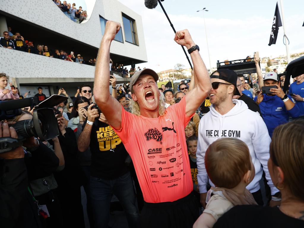 Nedd Brockmann celebrates after arriving at North Bondi Surf Life Saving Club after spending the last 46 days running from Perth. Picture: Richard Dobson