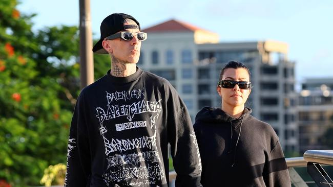 Travis Barker and Kourtney Kardashian walking on the Riverwalk in Brisbane. Photo - WP Media