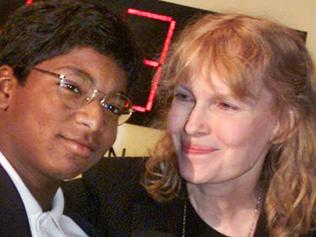 FILE - In this Sept. 27, 2000 file photo, actress Mia Farrow poses with her adopted son Thaddeus as they participate in the global summit on polio eradication at United Nations headquarters. Thaddeus Wilk Farrow, died, Wednesday, Sept 21, 2016, after being found seriously injured in his vehicle in Connecticut. The actress adopted Thaddeus, who contracted polio in an orphanage in Kolkata, India, and was paralyzed from the waist down. He was 27. (AP Photo/Richard Drew, File)