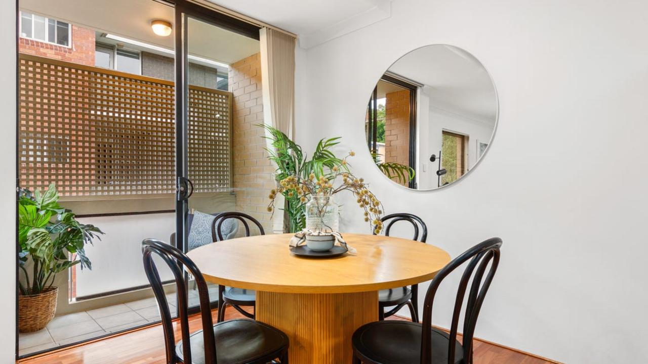 The open-plan living and dining area opens to a terrace.