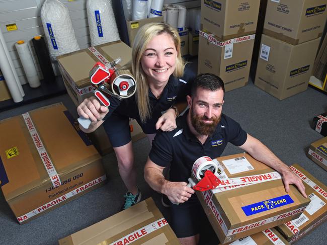 Townsville Pack & Send franchisees, Lewis and Dimity Brown at their business premises in Townsville.