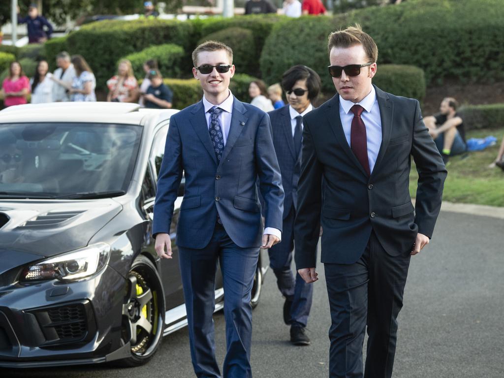 Graduates (from front) Jack Franzmann, Matthew Kruger and Dylan Verches arrive at Mary MacKillop Catholic College formal at Highfields Cultural Centre, Thursday, November 14, 2024. Picture: Kevin Farmer