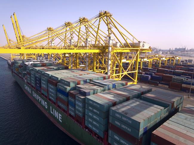 A container ship owned by China Shipping Container Lines Co. Ltd. is loaded at Jebel Ali Port, in Dubai, United Arab Emirates, on Wednesday, Dec. 26, 2007. Jebel Ali Port, owned by DP World Ltd., the fourth-biggest port operator, is the largest in the Middle East. Photographer: Charles Crowell/Bloomberg News