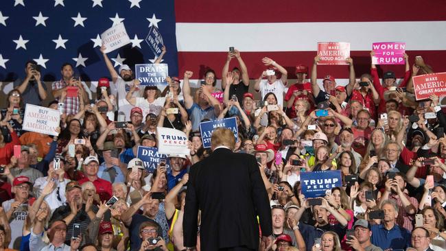 Supporters cheer as US President Donald Trump arrives at a rally. Picture: AFP