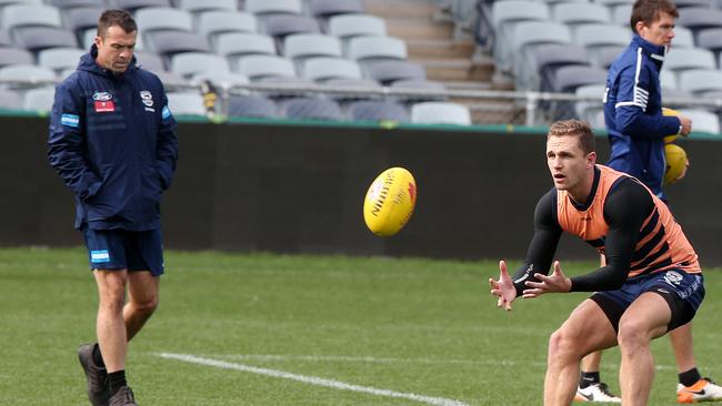 Chris Scott monitor’s Joel Selwood’s progress at Geelong training. Picture: Alison Wynd.