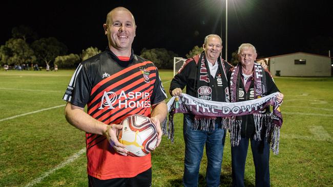 Goalkeeper Ben Aldridge, pictured with ex-players Bernie Kenyon and Tony Partridge, has been a hero during Elizabeth Downs’ history-making FFA Cup SA run. Picture: Morgan Sette