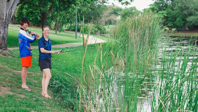 Palmerston Council alderman Lucy Morrison and her stepson Sol Healy-Morrison fishing for barra in Palmerston. Picture Glenn Campbell