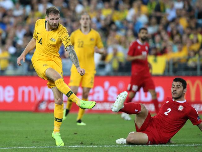 Australia's Martin Boyle (L) scores against Lebanon during their international friendly football match in Sydney on November 20, 2018 (Photo by DAVID MOIR / AFP)