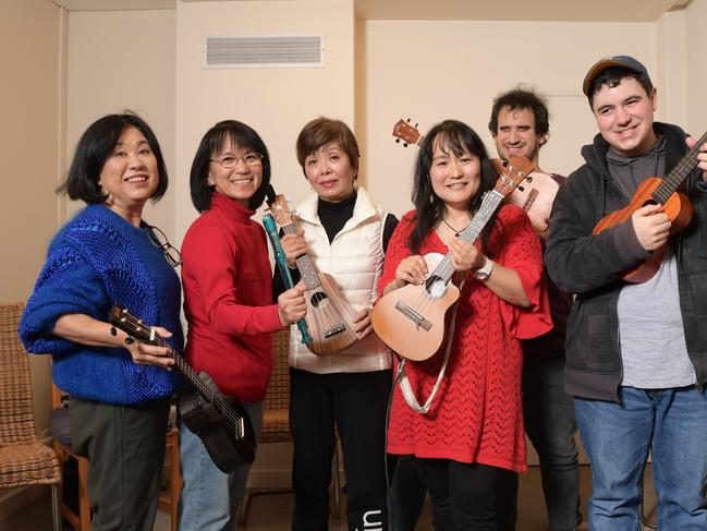 Izumi Nago with music therapy students (L to R) Yasco Pierce, Tachi, Michie Spain, Luke Abdullah and Phillip Pogossov at her studio in Pennant Hills Tuesday July 24, 2018.She runs music classes for kids with disabilities. (AAP IMAGE/Simon Bullard)