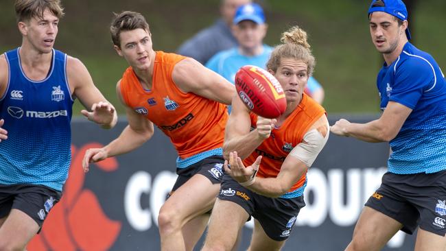 Speedy midfielder Jed Anderson fires out a handball at pre-season training.