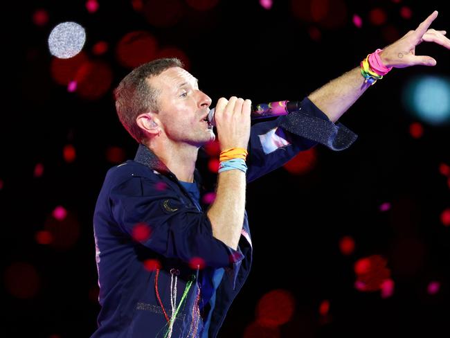 Chris Martin had the crown on his feet from the moment he took the stage at Accor Stadium at Sydney Olympic Park. Picture: Jonathan Ng