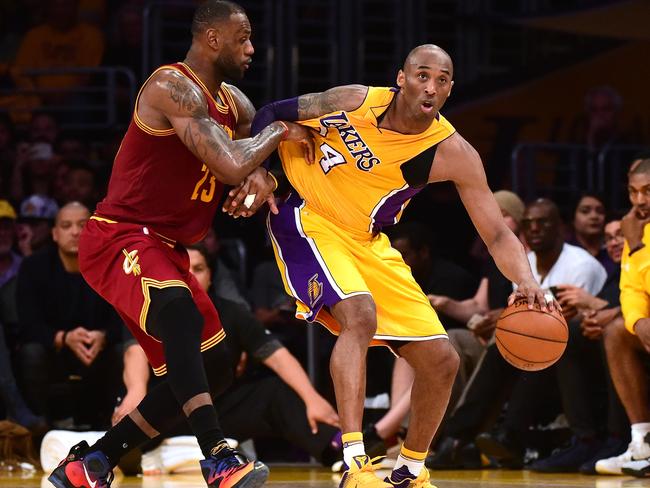 Kobe Bryant #24 of the Los Angeles Lakers backs in on LeBron James #23 of the Cleveland Cavaliers in 2016. Picture: Getty