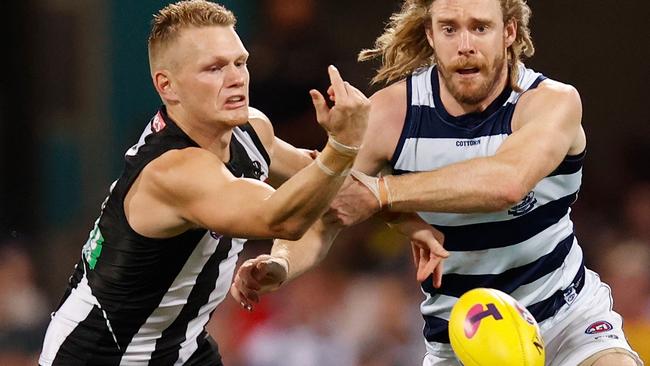 Adam Treloar battles with Cat Cam Guthrie during the Magpies crushing loss to Geelong in the semi final. Picture: AFL Photos/Getty Images