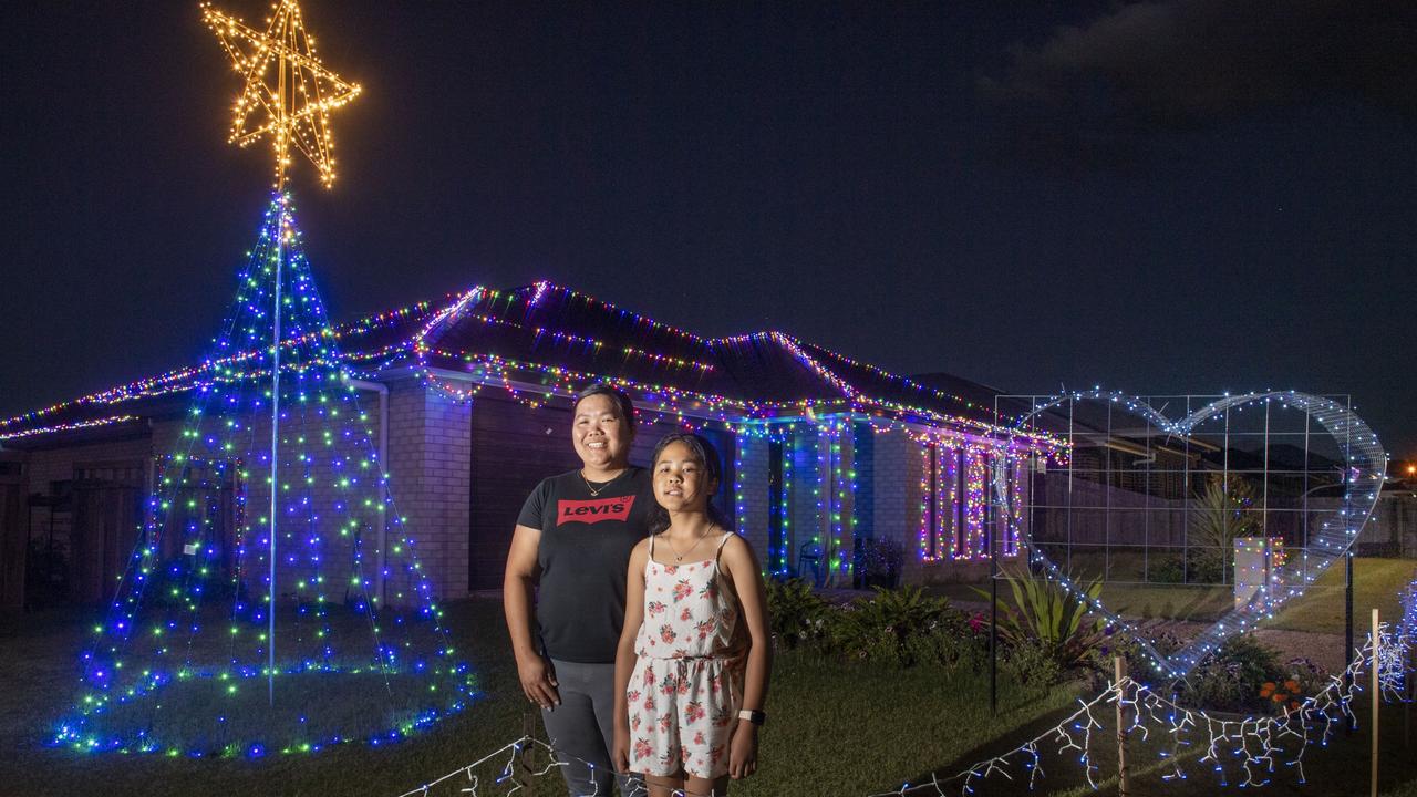 Florida Calibuyut with her daughter Ashley outside their home's Christmas display in Milford St Westbrook. Friday, December 3, 2021. Picture: Nev Madsen.