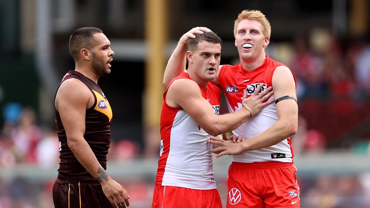 Tom Papley and Matt Roberts celebrate another Sydney goal as Jarman Impey looks on. Picture: Brendon Thorne/AFL Photos/via Getty Images