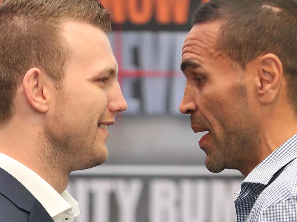 Jeff Horn and Anthony Mundine face off during a media conference in the Brissbane Queen Street Mall. Pic Peter Wallis