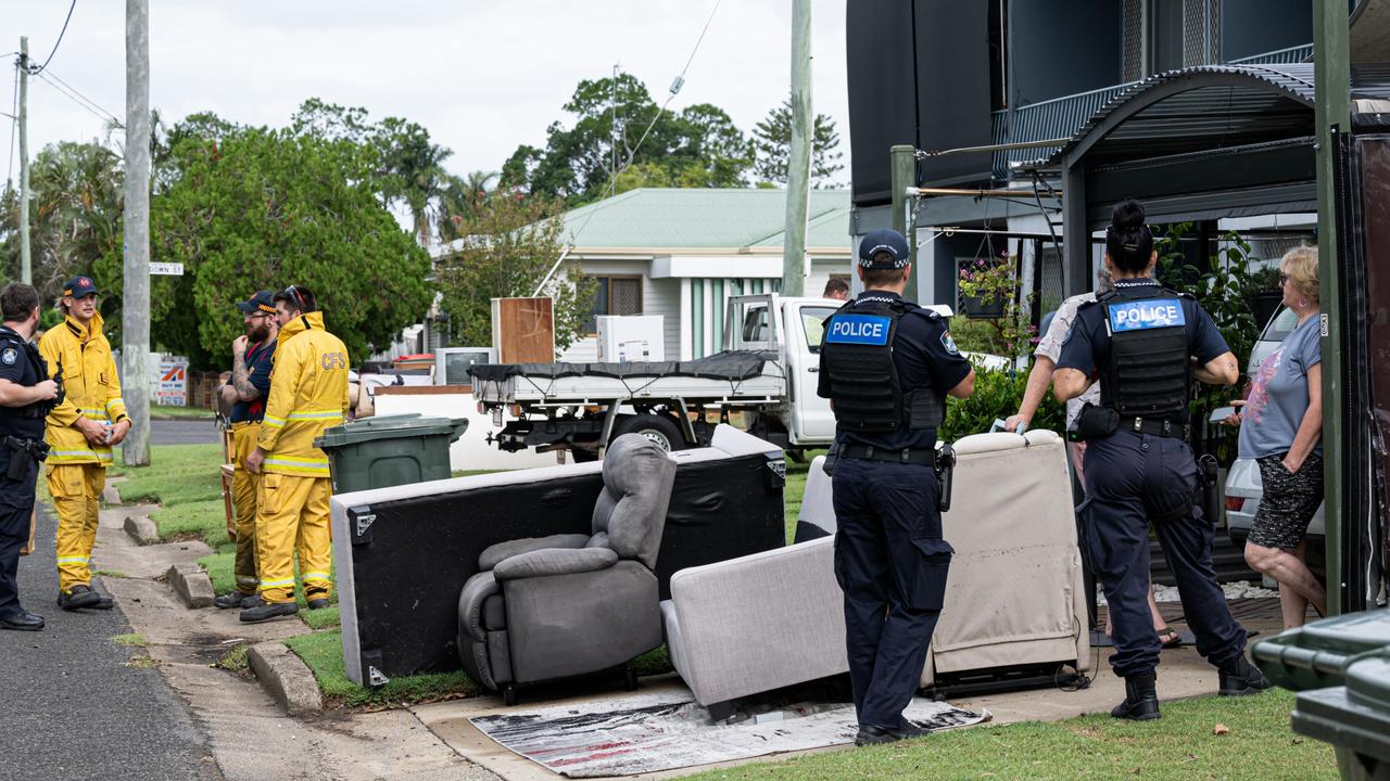 Police and firefighters door knocking residents to warn of looting and other risks. Photo Paul Beutel