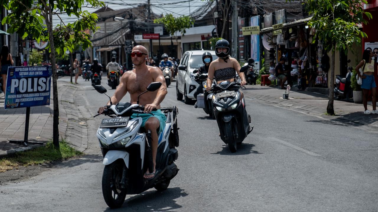 Tourists not wearing helmets and disobeying road rules has been a big talking point amid the crackdown on misbehaving foreigners. Picture: Agunng Parameswara/Getty Images