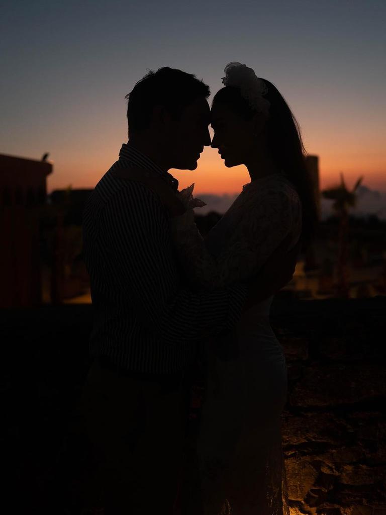 The couple enjoy some silence as the sun sets on their big day.