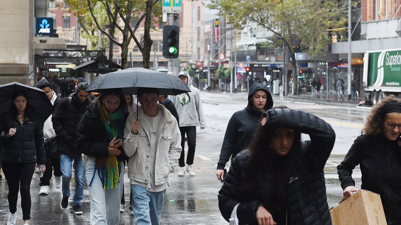 Shoppers are seen walking across a street. Picture: Josie Hayden