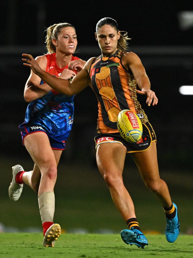 CAIRNS, AUSTRALIA - OCTOBER 24: Eliza West of the Hawks prepares to kick under pressure during the round nine AFLW match between Hawthorn Hawks and Narrm (Melbourne Demons) at Cazaly's Stadium, on October 24, 2024, in Cairns, Australia. (Photo by Emily Barker/Getty Images)