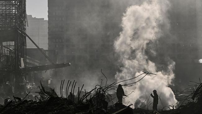 Firefighters douse the fire in the Retroville shopping mall after a Russian attack on the northwest of the capital Kyiv. Picture: AFP.