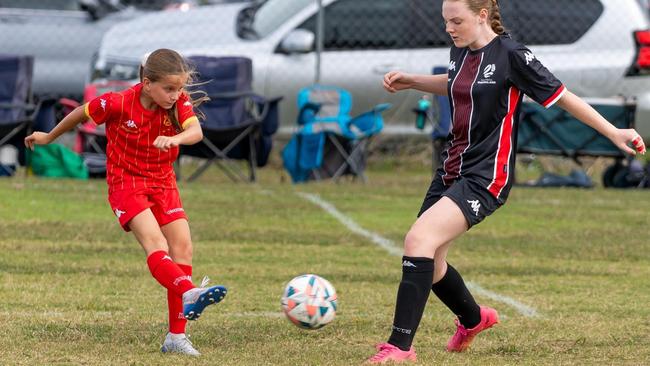 Burdekin FC junior footballer Maicey Ferguson (in red). Picture: FQ Northern