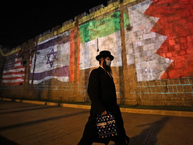 The flags of America, Israel, United Arab Emirates, and Bahrain are projected on the ramparts of Jerusalem's Old City. Picture: AFP