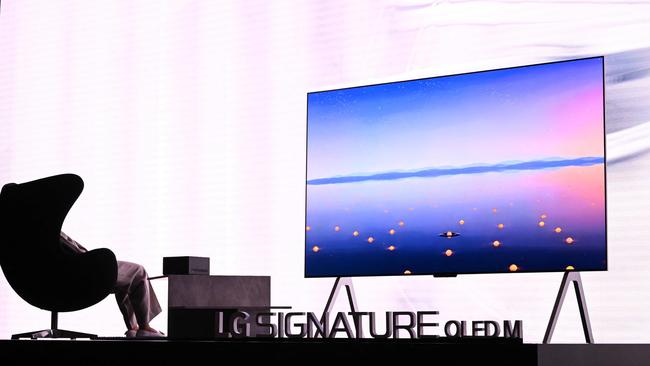 The LG Signature OLED M TV is unveiled at CES. As you can see, no wires hang down from its rear. (Photo by Patrick T. Fallon / AFP)