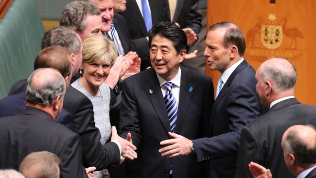 Tony Abbott leads Shinzo Abe around the chamber after his address in 2014.