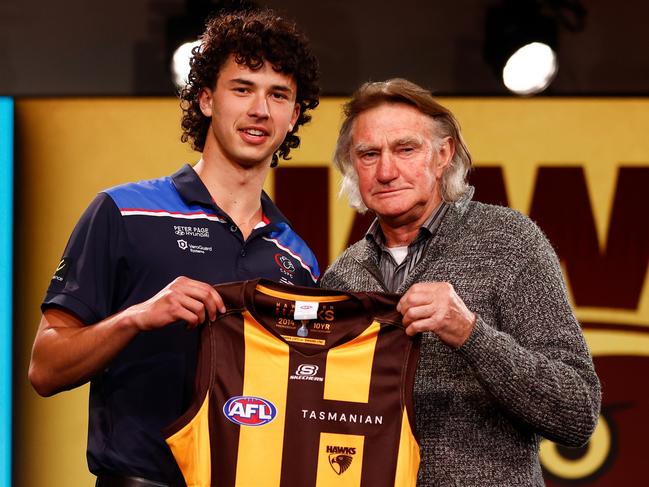 MELBOURNE, AUSTRALIA - NOVEMBER 20: William McCabe is seen with Michael Tuck after being selected at number 19 by Hawthorn during the 2023 AFL Draft at Marvel Stadium on November 20, 2023 in Melbourne, Australia. (Photo by Michael Willson/AFL Photos via Getty Images)