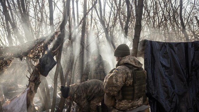 Members of a Ukrainian artillery unit wait in a wooded area in Donetsk for new target co-ordinates. Picture: Getty Images/The Times