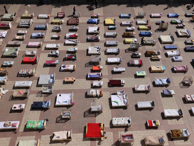 Beds representing the number of Israeli hostages held by Palestinian militants since the October 7 attack were placed outside the Jerusalem Municipality building on October 30. Picture: Ahmad Gharabli/AFP