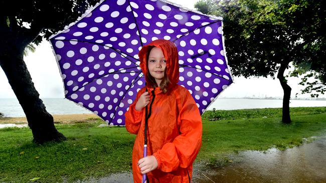 Caitlin Lawrey, 10, didn't let the rain stop her enjoying the Australia Day public holiday on the Strand on Monday. PICTURE: MATT TAYLOR.