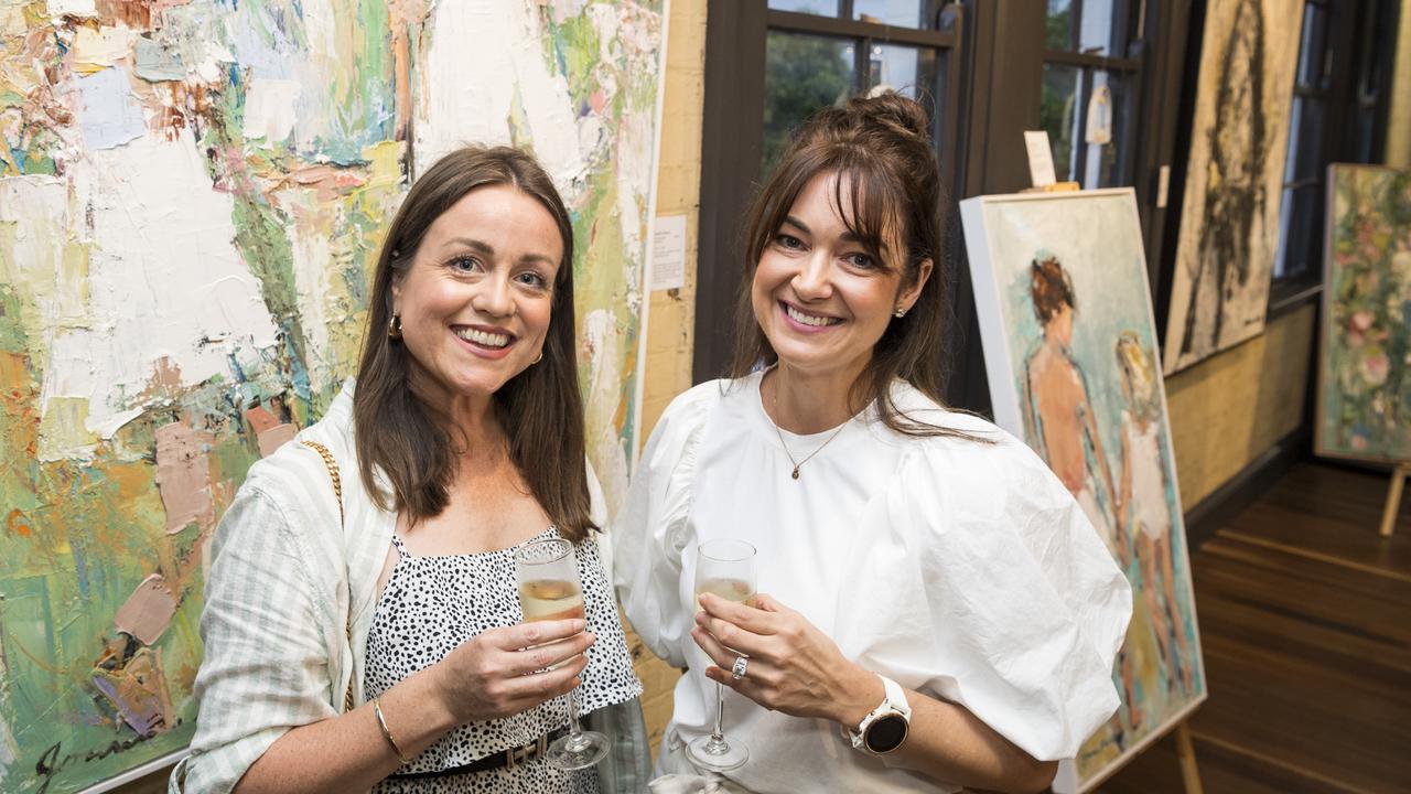 Abi Stephenson (left) and Sally Cleary at the opening of Unbridled by Joanna Davies at The Toowoomba Gallery, Thursday, October 21, 2021. Picture: Kevin Farmer