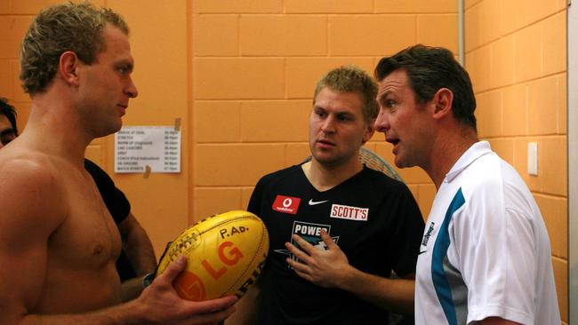 Phil Walsh talks pre-match with the Cornes brothers (Kane is centre).