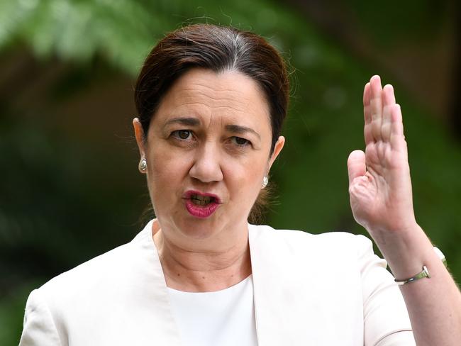 Queensland Premier Annastacia Palaszczuk gestures as she speaks during a press conference at Parliament House in Brisbane, Wednesday, April 8, 2020. The press conference addressed issues relating to the coronavirus COVID-19 pandemic. (AAP Image/Dan Peled) NO ARCHIVING