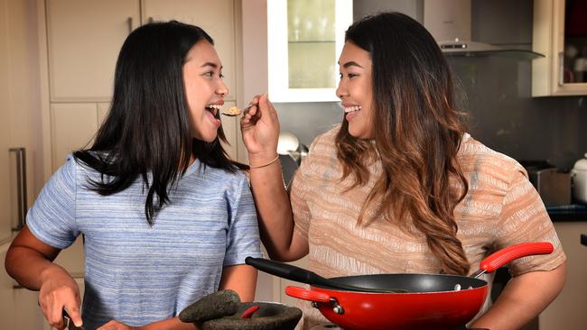 Tasia and Gracia Seger cooking at home. Picture: Tony Gough