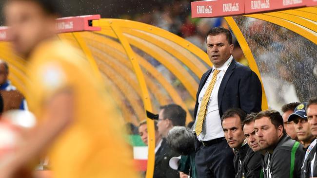 Australian coach Ange Postecoglou (standing) during the first round Asian Cup football match between Australia and Kuwait in Melbourne on January 9, 2015. AFP PHOTO / MAL FAIRCLOUGH IMAGE RESTRICTED TO EDITORIAL USE - STRICTLY NO COMMERCIAL USE