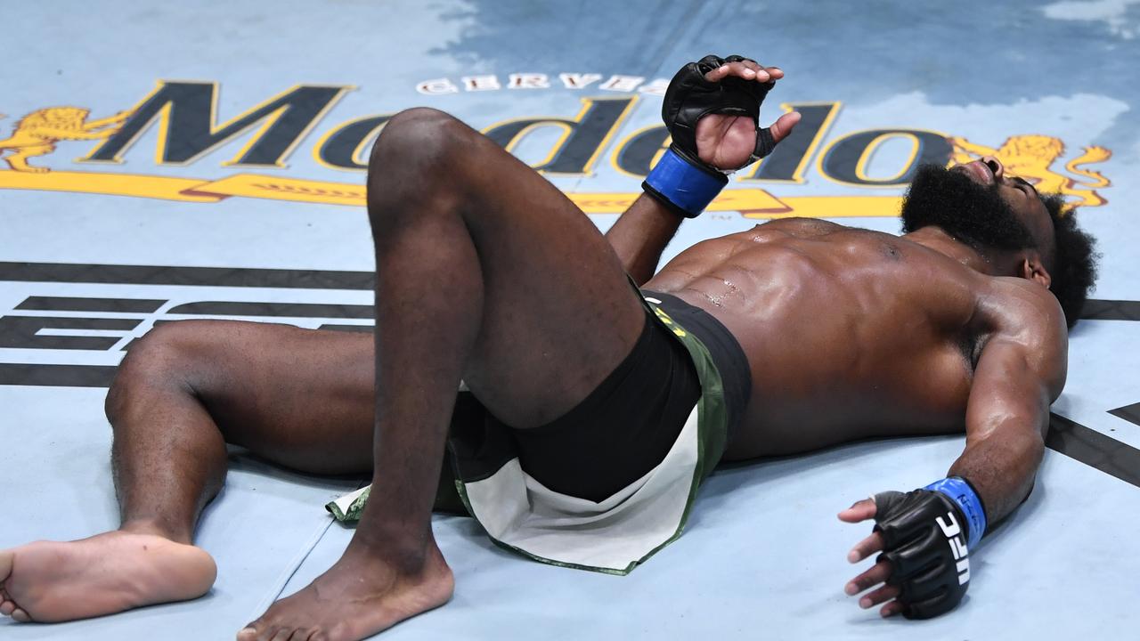 Aljamain Sterling reacts after receiving an illegal knee against Petr Yan.