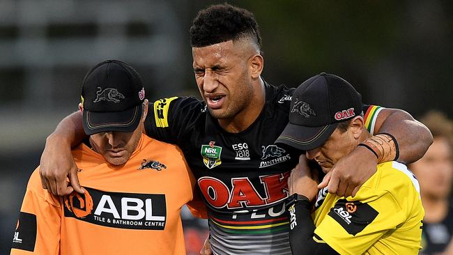 Viliame Kikau assisted from the field after sustaining a knee injury.