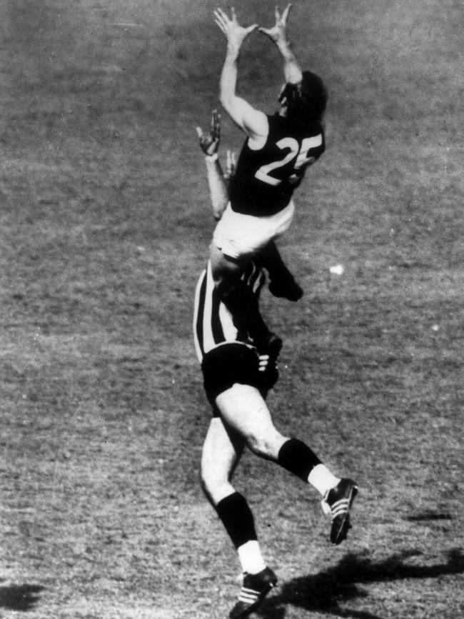 Mike Williamson memorably captured the moment Alex Jesaulenko soared over Graeme 'Jerker' Jenkin in the 1970 Grand Final.