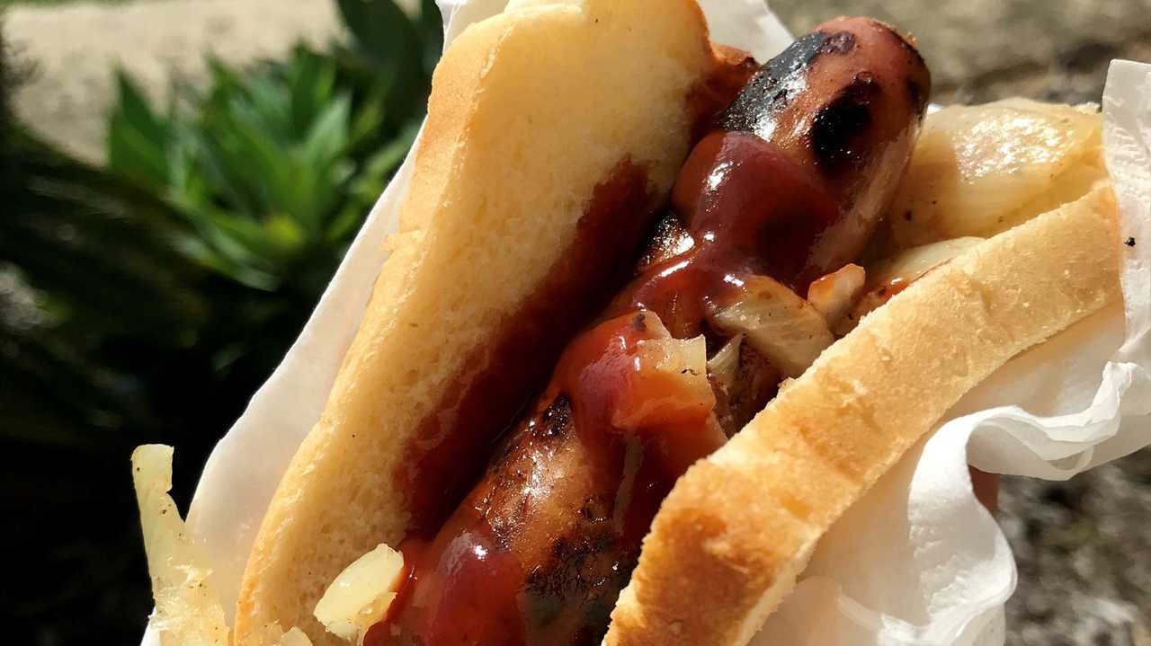 An election snag cooked to perfection by the Habana Progress Association at the Fitzgerald State School polling station. Picture: Angela Seng