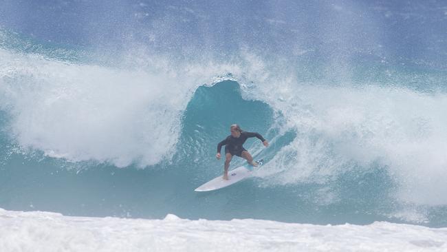 Surfers enjoying the larger swell at Snapper Rocks on Sunday 2 January 2022. Picture: Jerad Williams